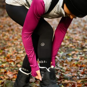Woman wearing the Fleece Lined Legging in the colour black.