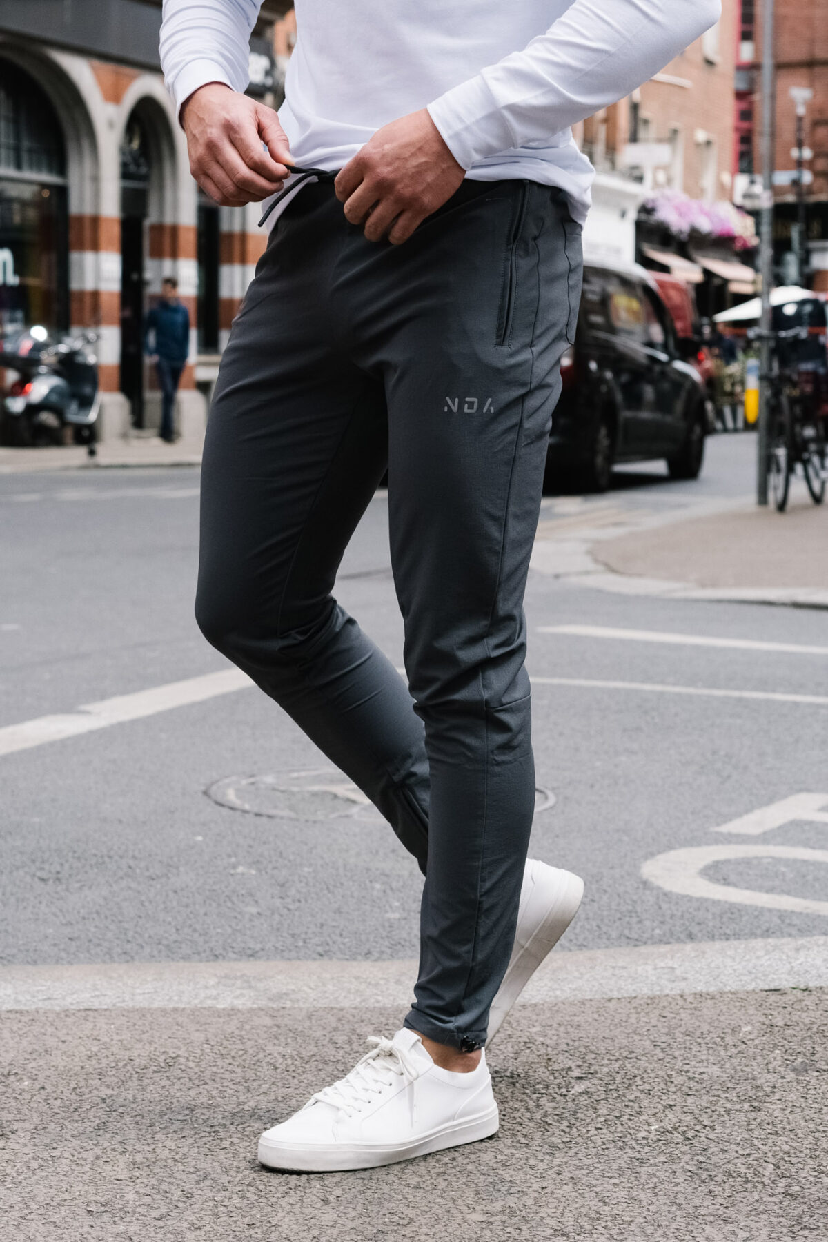 Man wearing the Explore Jogger in charcoal.