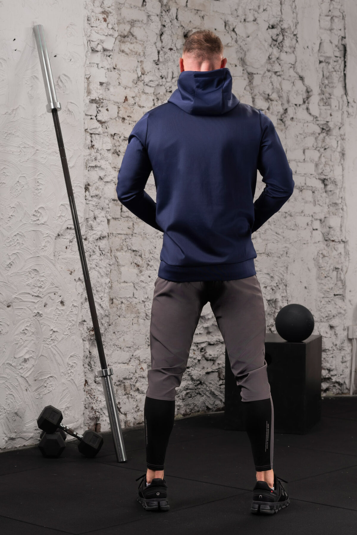 The Integrity Unisex Hoodie (Navy) is a sleek functional pullover style with integrated pockets. Scuba like material for warmth in the colder months, with a high neckline and drawstrings for defined coverage for the perfect pre and post workout hoodie.