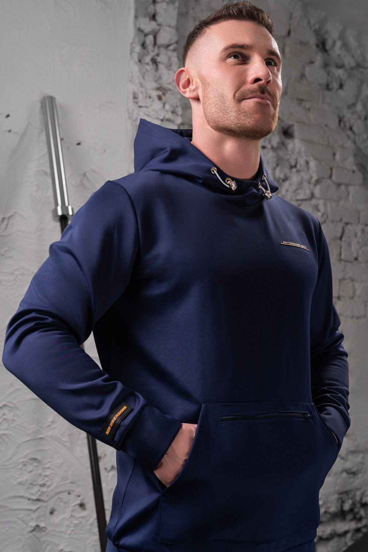 The Integrity Unisex Hoodie (Navy) is a sleek functional pullover style with integrated pockets. Scuba like material for warmth in the colder months, with a high neckline and drawstrings for defined coverage for the perfect pre and post workout hoodie.