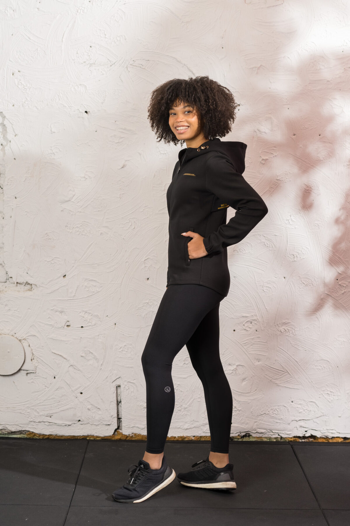 Ultra warm, our Virtue Zip Hoodie (Black) brings you endless comfort, all while looking great. Full zip with a split dipped hem. Super soft cotton, aligns with the sleek shape to make you feel comfortable on the move.