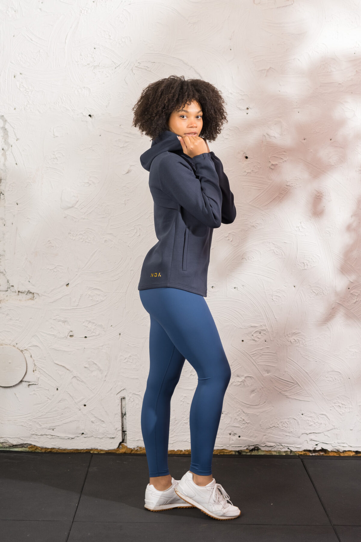 Ultra warm, our Virtue Zip Hoodie (Navy) brings you endless comfort, all while looking great. Full zip with a split dipped hem. Super soft cotton, aligns with the sleek shape to make you feel comfortable on the move.