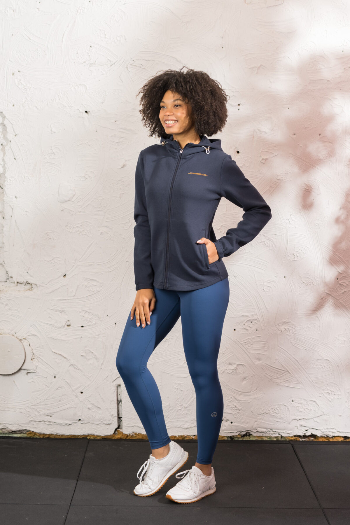 Ultra warm, our Virtue Zip Hoodie (Navy) brings you endless comfort, all while looking great. Full zip with a split dipped hem. Super soft cotton, aligns with the sleek shape to make you feel comfortable on the move.