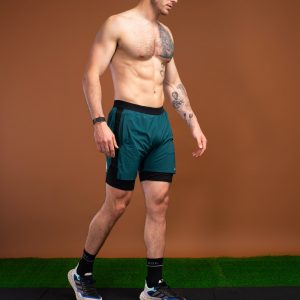 Introducing the revolutionary Benchmark Performance Shorts (Dark Teal)! Our new innovation is disguised as a 2 in 1, but is in fact an outer layer attached to the under layer to optimise movement and provide the best performance possible. These shorts are made from a lightweight and breathable fabric that is designed to provide a comfortable fit and move with you. The fabric is also water-resistant, so you can stay dry and comfortable no matter the activity. The four-way stretch fabric ensures that you have the full range of movement needed to perform your best.