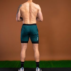 Introducing the revolutionary Benchmark Performance Shorts (Dark Teal)! Our new innovation is disguised as a 2 in 1, but is in fact an outer layer attached to the under layer to optimise movement and provide the best performance possible. These shorts are made from a lightweight and breathable fabric that is designed to provide a comfortable fit and move with you. The fabric is also water-resistant, so you can stay dry and comfortable no matter the activity. The four-way stretch fabric ensures that you have the full range of movement needed to perform your best.