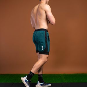 Introducing the revolutionary Benchmark Performance Shorts (Dark Teal)! Our new innovation is disguised as a 2 in 1, but is in fact an outer layer attached to the under layer to optimise movement and provide the best performance possible. These shorts are made from a lightweight and breathable fabric that is designed to provide a comfortable fit and move with you. The fabric is also water-resistant, so you can stay dry and comfortable no matter the activity. The four-way stretch fabric ensures that you have the full range of movement needed to perform your best.