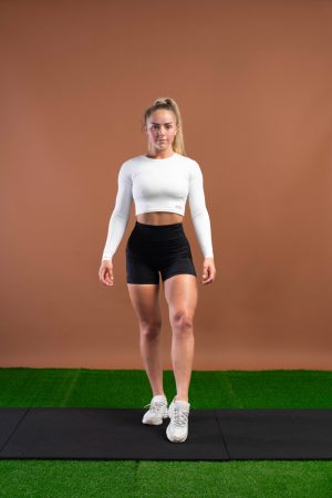 Designed with the same mix of materials as our Elite 1.0 Legging Collection, This new shorts gives you a high waistband for coverage and support with added length to the inside seam to stop your shorts riding up, with a phone holding pocket and reflective side logo Available in 5 Sizes. Made for performance.