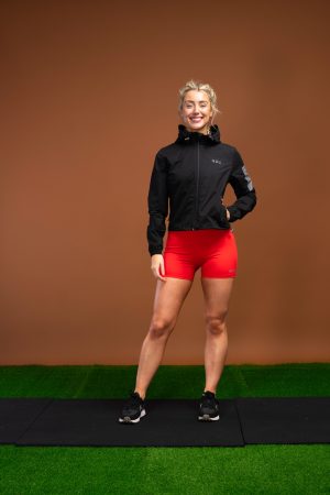 The Women’s Tempo Jacket (Black) is designed with functional fabric that helps keep any moisture away from your skin, keeping you dry throughout your run or HIIT session. Cropped style with a 4 way stretch ensures comfort and mobility. The elasticated hood that stays in place while you move, with a full zip front and pockets allows for a safe workout. Elasticated hem for the perfect fit and reflective details makes this the ideal warm weather running jacket.