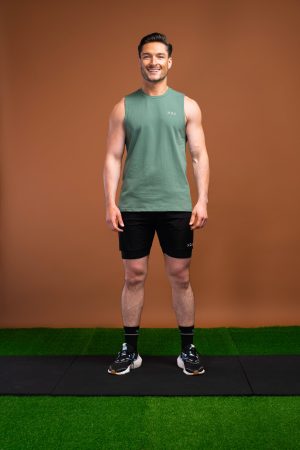 The Benchmark Tank Top (Olive) is designed to keep you cool and comfortable in any situation. The cotton blend material is soft and breathable, allowing air to circulate freely and keeping you cool. The stretch in the material ensures you can move without feeling restricted. The sleeveless design and high neckline give you a stylish look, while the lightweight material won’t weigh you down.
