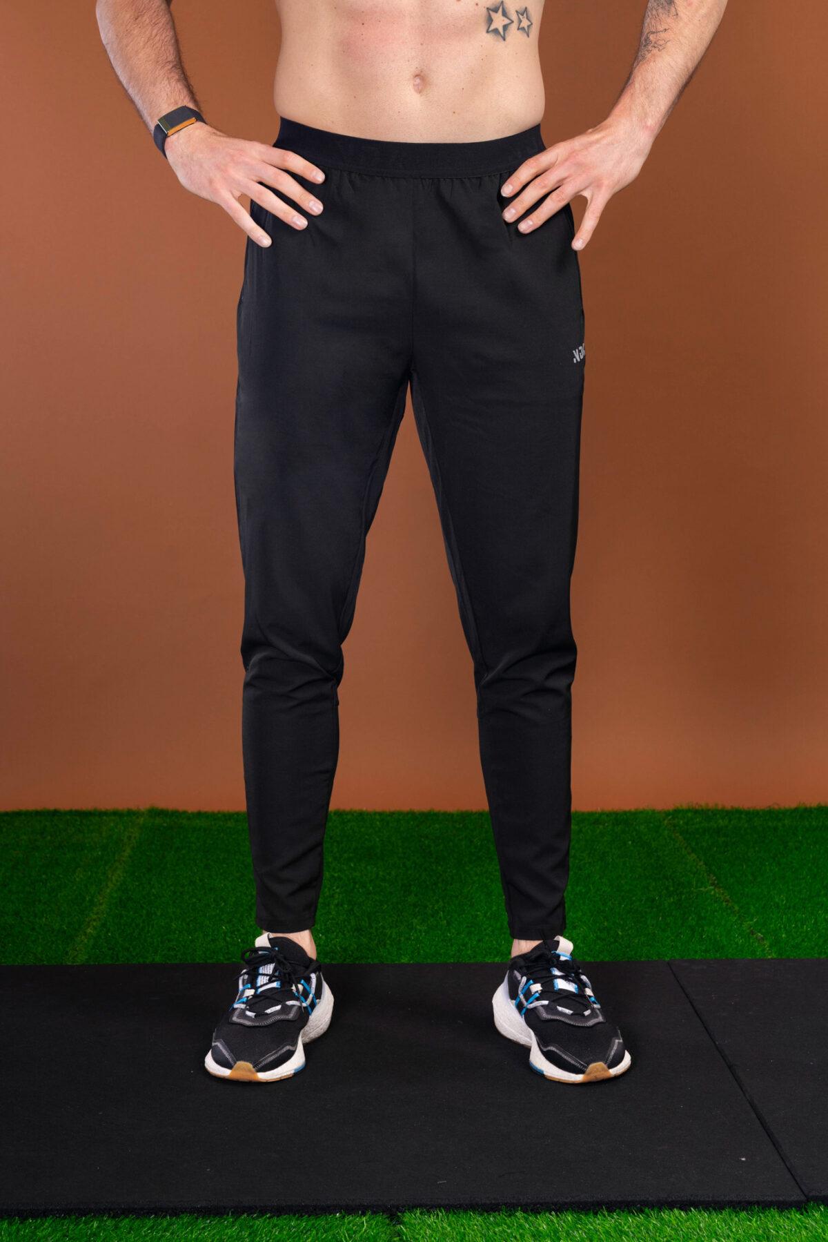 The Benchmark Jogger (Black) is made from a lightweight, breathable fabric that helps keep you cool and comfortable during any activity. The fabric also helps to wick away moisture, which is great for those hot summer days. The joggers also feature a slim fit that hugs your body in all the right places. The elasticated waistband also provides a secure fit and helps keep the joggers in place.