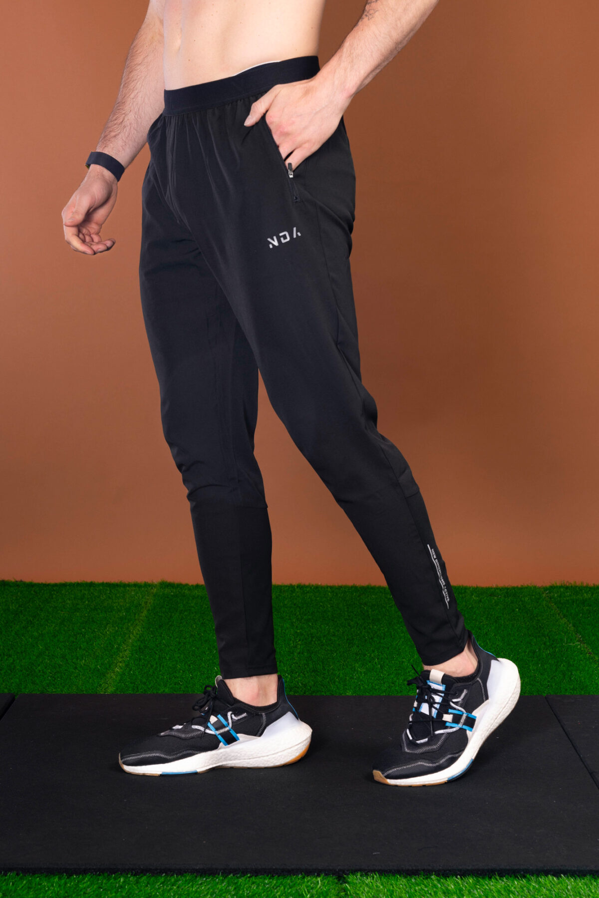 The Benchmark Jogger (Black) is made from a lightweight, breathable fabric that helps keep you cool and comfortable during any activity. The fabric also helps to wick away moisture, which is great for those hot summer days. The joggers also feature a slim fit that hugs your body in all the right places. The elasticated waistband also provides a secure fit and helps keep the joggers in place.