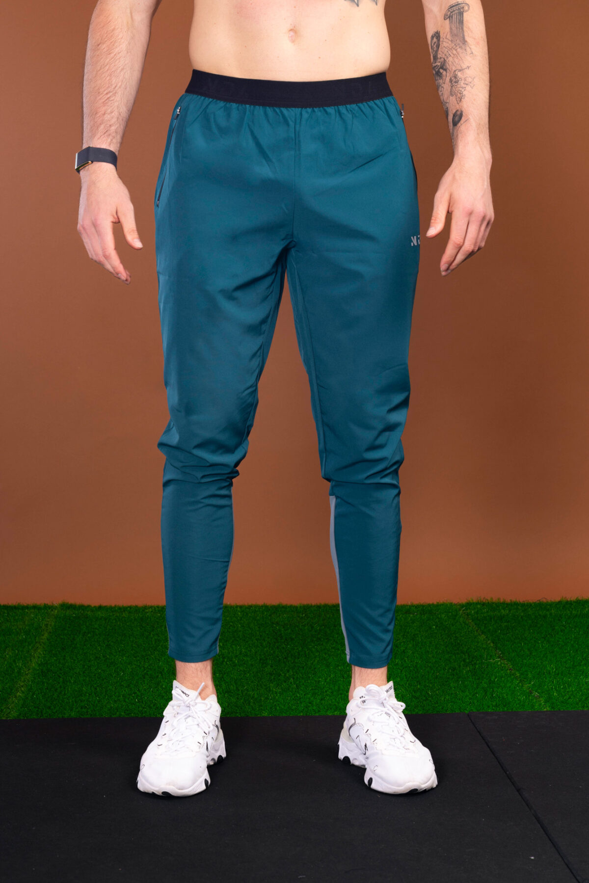 The Benchmark Jogger (Teal) is made from a lightweight, breathable fabric that helps keep you cool and comfortable during any activity. The fabric also helps to wick away moisture, which is great for those hot summer days. The joggers also feature a slim fit that hugs your body in all the right places. The elasticated waistband also provides a secure fit and helps keep the joggers in place.