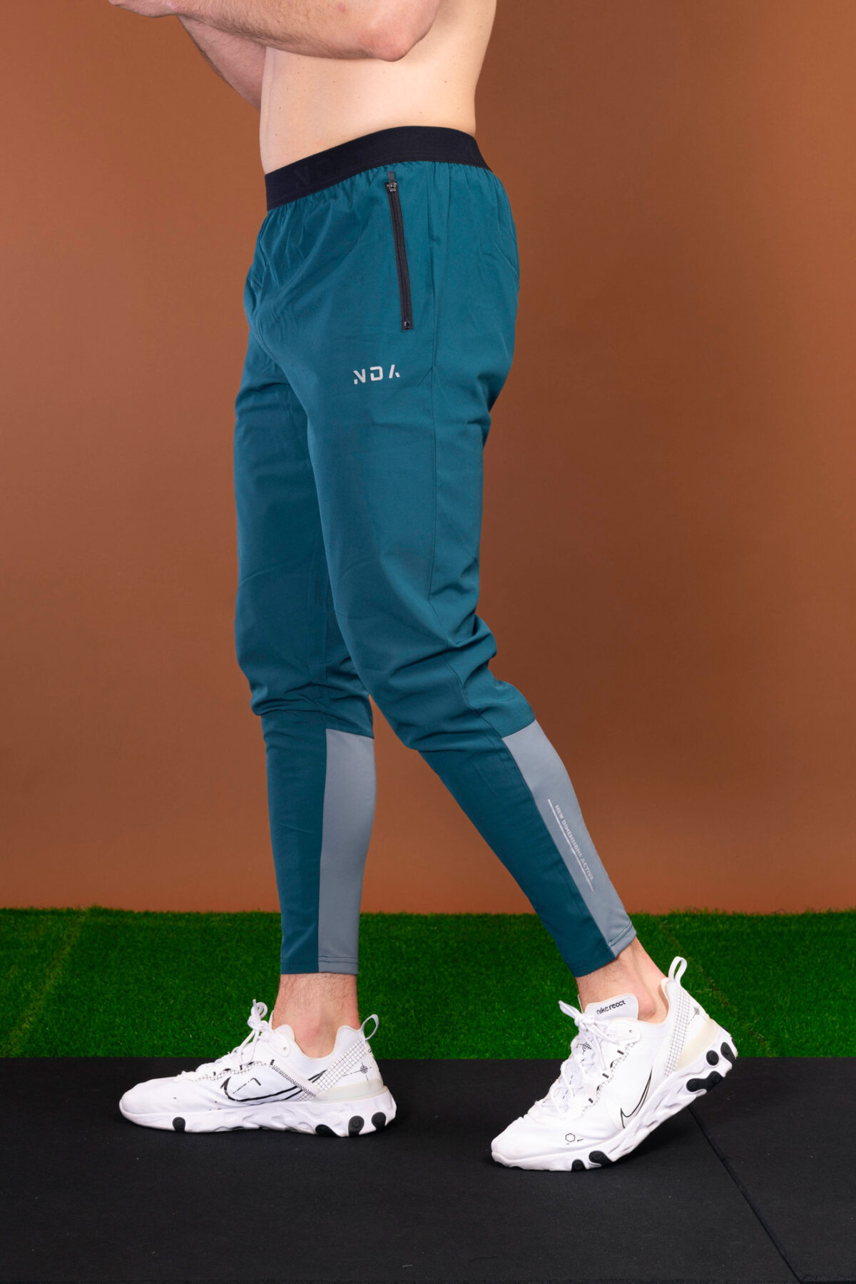 The Benchmark Jogger (Teal) is made from a lightweight, breathable fabric that helps keep you cool and comfortable during any activity. The fabric also helps to wick away moisture, which is great for those hot summer days. The joggers also feature a slim fit that hugs your body in all the right places. The elasticated waistband also provides a secure fit and helps keep the joggers in place.