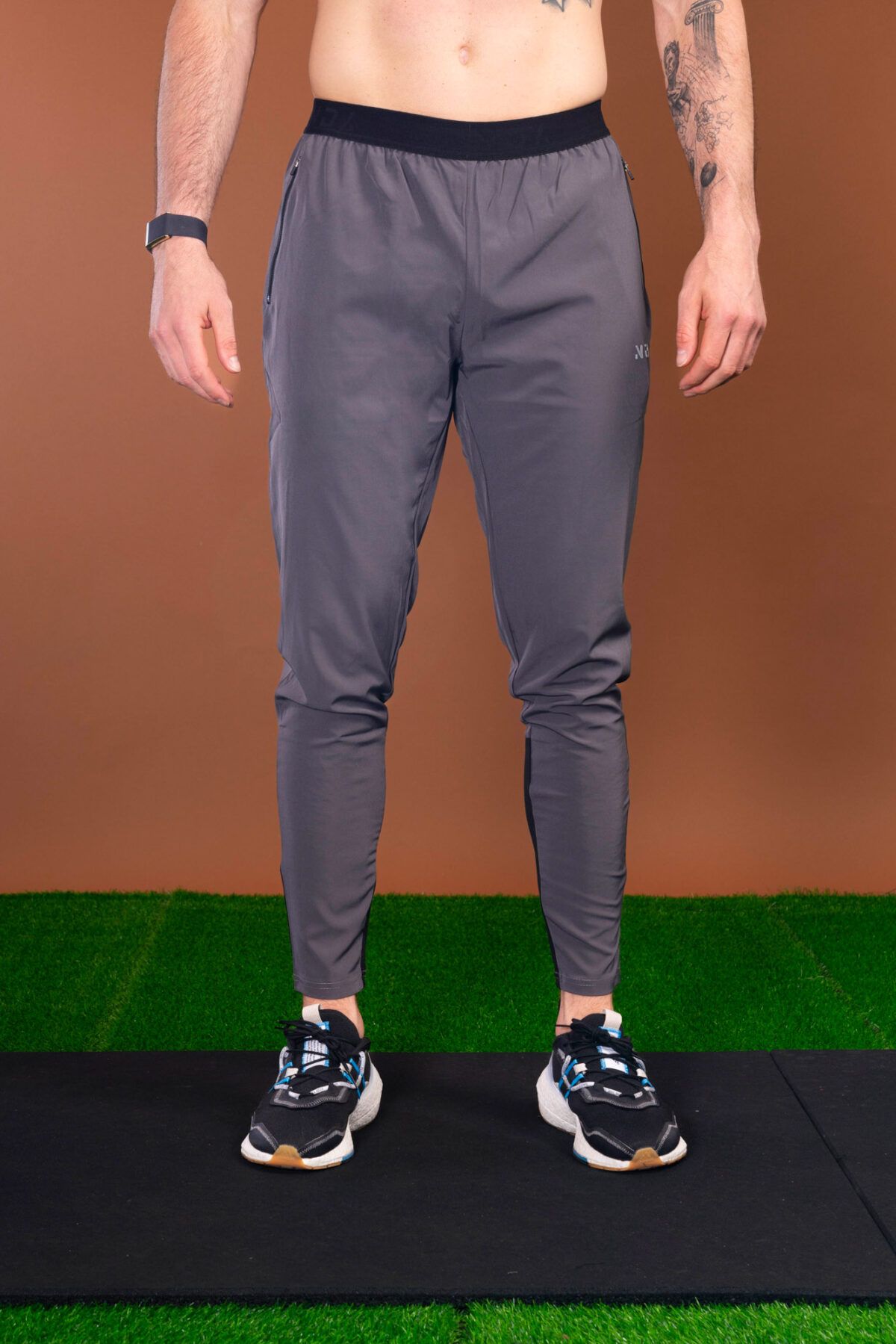 The Benchmark Jogger (Grey) is made from a lightweight, breathable fabric that helps keep you cool and comfortable during any activity. The fabric also helps to wick away moisture, which is great for those hot summer days. The joggers also feature a slim fit that hugs your body in all the right places. The elasticated waistband also provides a secure fit and helps keep the joggers in place.