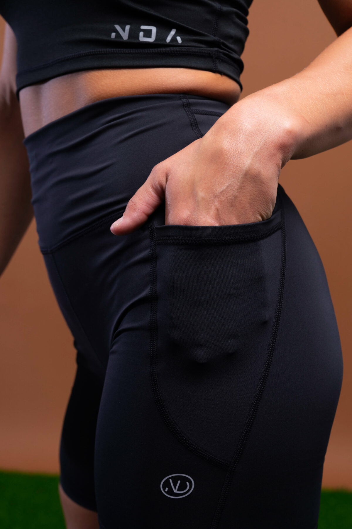 The Limitless Compression Shorts (Black) is the perfect activewear for any and all of your fitness needs. This mid-length 7-inch short is designed to provide maximum comfort and support during your workouts. With a new shape-enhancing back detail, you can be sure that your shorts will stay in place no matter how intense your workout is.They also feature a side accessory pocket, so you can store your keys or phone while you’re working out. The reflective logos make you visible in low light conditions, so you can stay safe while exercising outdoors. The mottled pattern adds a stylish touch to the shorts, while the flatline drawstring elastic ensures a secure fit.