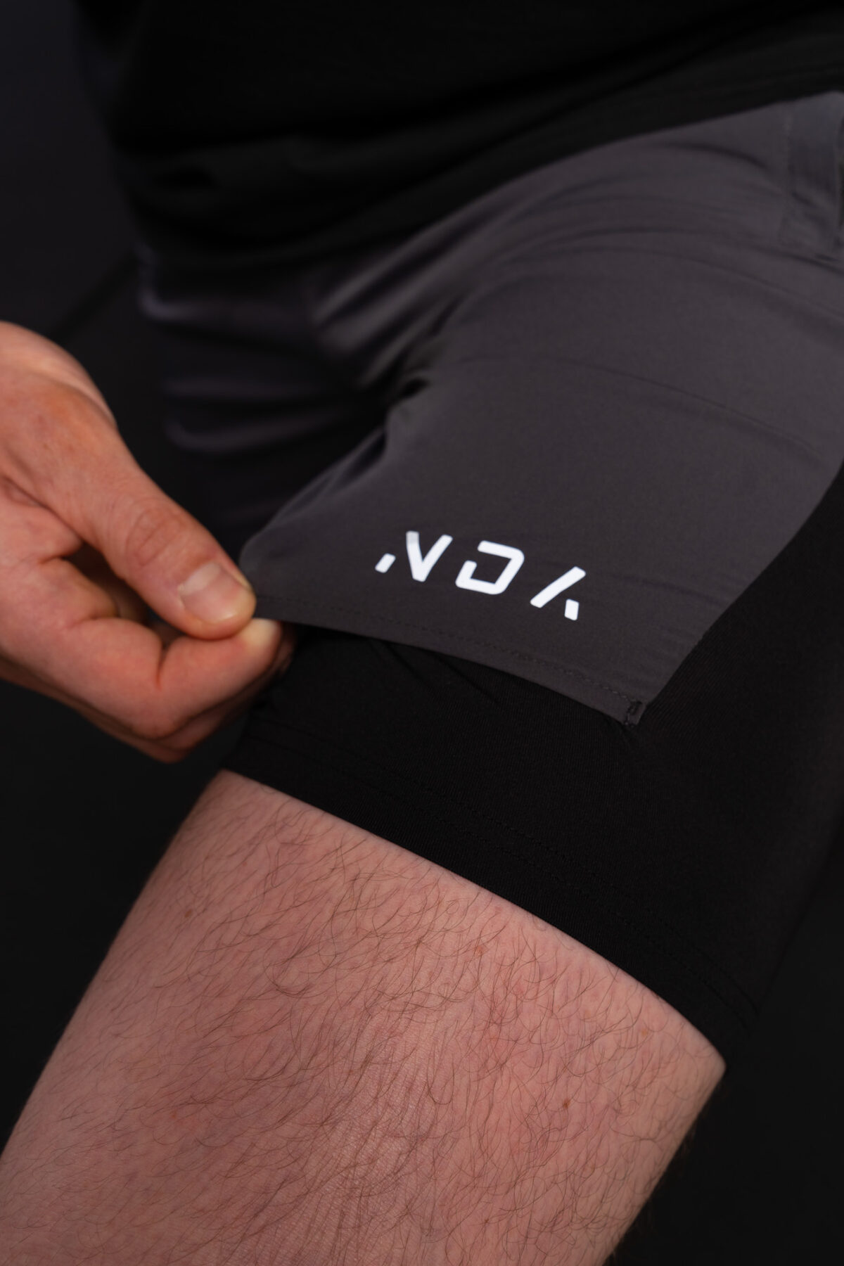 Introducing the revolutionary Benchmark Performance Shorts (Grey)! Our new innovation is disguised as a 2 in 1, but is in fact an outer layer attached to the under layer to optimise movement and provide the best performance possible. These shorts are made from a lightweight and breathable fabric that is designed to provide a comfortable fit and move with you. The fabric is also water-resistant, so you can stay dry and comfortable no matter the activity. The four-way stretch fabric ensures that you have the full range of movement needed to perform your best.