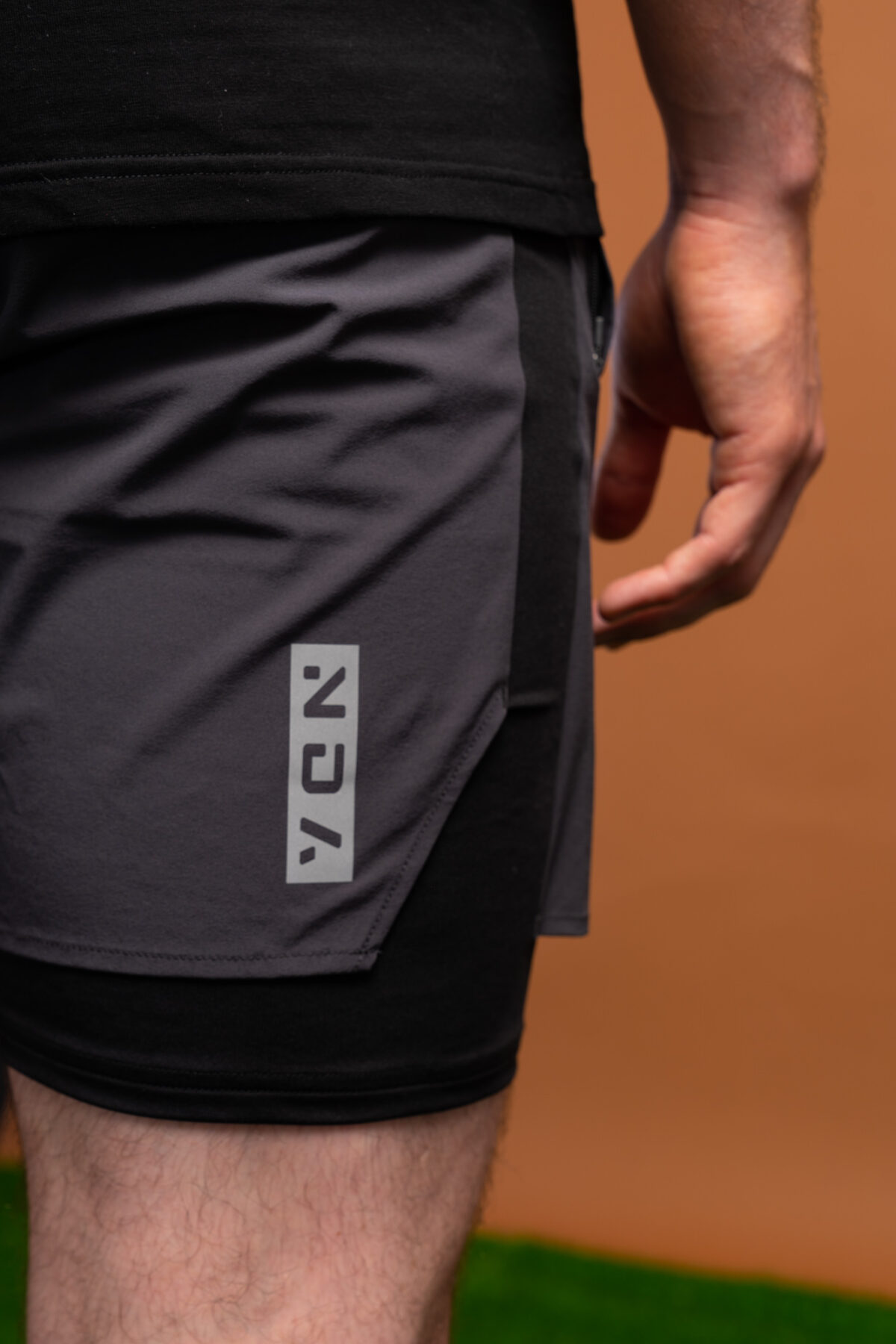 Introducing the revolutionary Benchmark Performance Shorts (Grey)! Our new innovation is disguised as a 2 in 1, but is in fact an outer layer attached to the under layer to optimise movement and provide the best performance possible. These shorts are made from a lightweight and breathable fabric that is designed to provide a comfortable fit and move with you. The fabric is also water-resistant, so you can stay dry and comfortable no matter the activity. The four-way stretch fabric ensures that you have the full range of movement needed to perform your best.