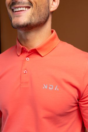 Tailored to move! This Tempo Golf Polo (Coral) is engineered for the movement and performance requirements of golf, it’s crafted in a cotton and spandex mix for a light wear with a soft feel. With a classic design, updated here with a modern, sportive 3-button neckline and textured trims. Pair with casual trousers and trainers for a relaxed weekend look whilst perfecting your swing.