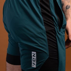Introducing the revolutionary Benchmark Performance Shorts (Dark Teal)! Our new innovation is disguised as a 2 in 1, but is in fact an outer layer attached to the under layer to optimise movement and provide the best performance possible. These shorts are made from a lightweight and breathable fabric that is designed to provide a comfortable fit and move with you. The fabric is also water-resistant, so you can stay dry and comfortable no matter the activity. The four-way stretch fabric ensures that you have the full range of movement needed to perform your best.