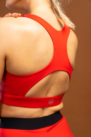 The PB Sports Bra (Red) is the perfect choice for your gym look. Featuring a lightweight, compressive material and sweat-wicking elements, you'll get the support you need to power through your workout. With its stylish design, you can stay fashionable while you break a sweat. Match the PB Sports Bra with your PB shorts for that staple gym look.