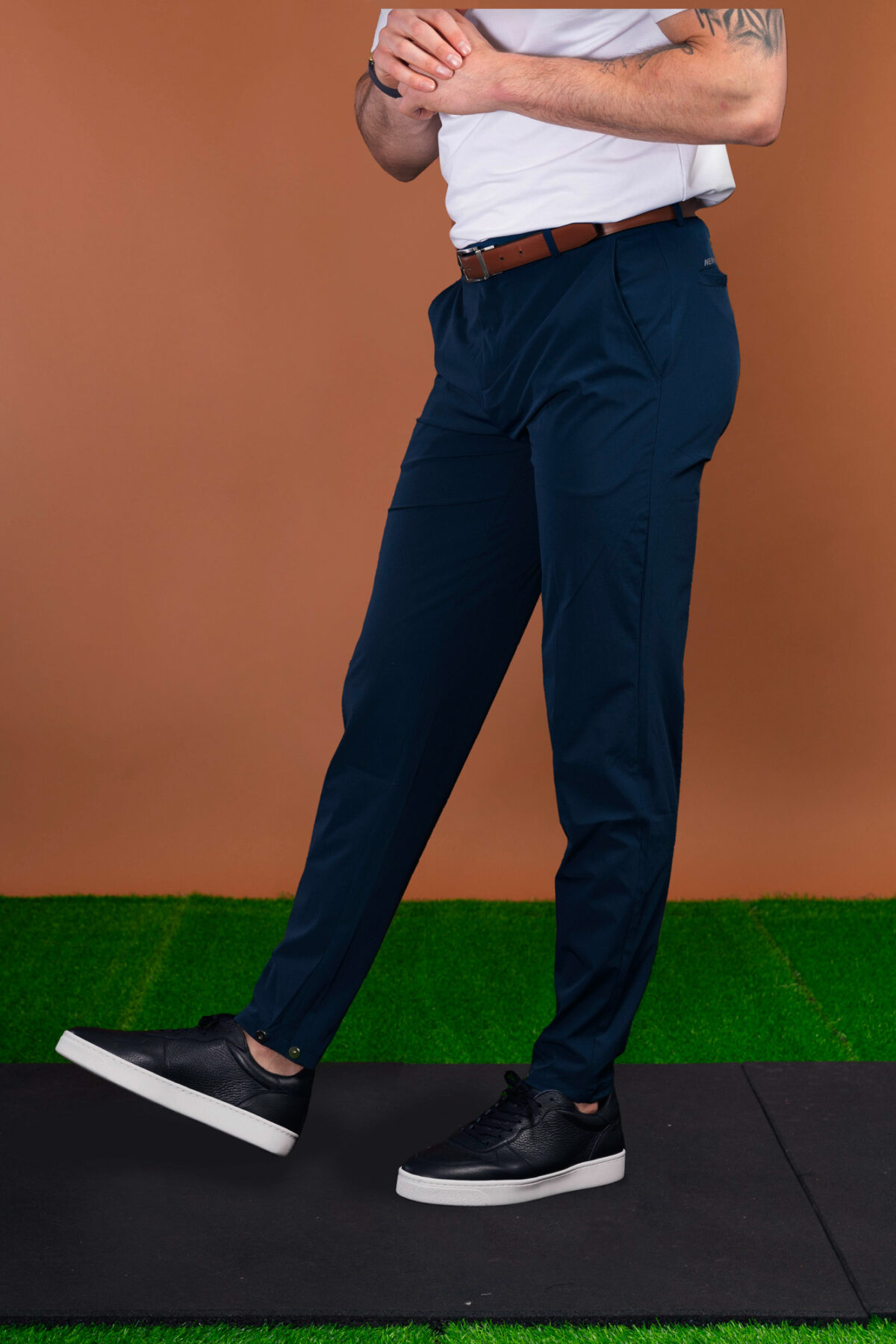 From the course to the commute and everywhere in between, these Tempo Golf Trouser (Navy) keeps your look fresh. The perfect trouser from the office to the golf course. Lightweight for the warmer months, with a mix of elastane to give you that full range of motion in your swing or extra comfort at the work desk. Keeping the look on trend, check out the magnetic clasp at the ankle that allows you to make the leg narrower if you wish.