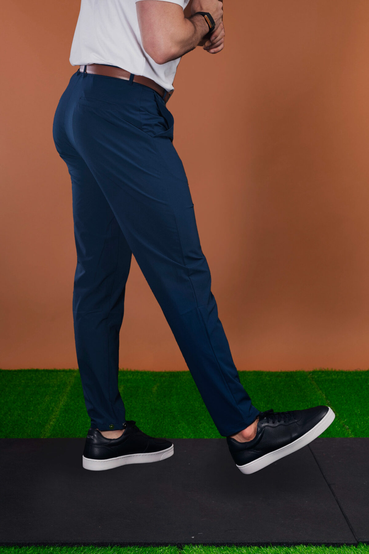 From the course to the commute and everywhere in between, these Tempo Golf Trouser (Navy) keeps your look fresh. The perfect trouser from the office to the golf course. Lightweight for the warmer months, with a mix of elastane to give you that full range of motion in your swing or extra comfort at the work desk. Keeping the look on trend, check out the magnetic clasp at the ankle that allows you to make the leg narrower if you wish.