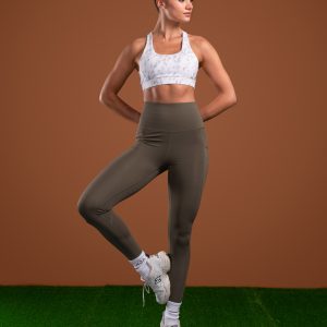 Introducing the Pacesetter Legging (Olive), the perfect choice for running and high tempo training. Our leggings are designed with high intensity in mind, featuring our new Hex-Elastic Technology waistband that provides superior support like no other. The fabric is also squat proof, allowing you to move with confidence. The Legging is designed to keep up with your active lifestyle. The fabric is lightweight and breathable, allowing you to stay cool and comfortable during your workout