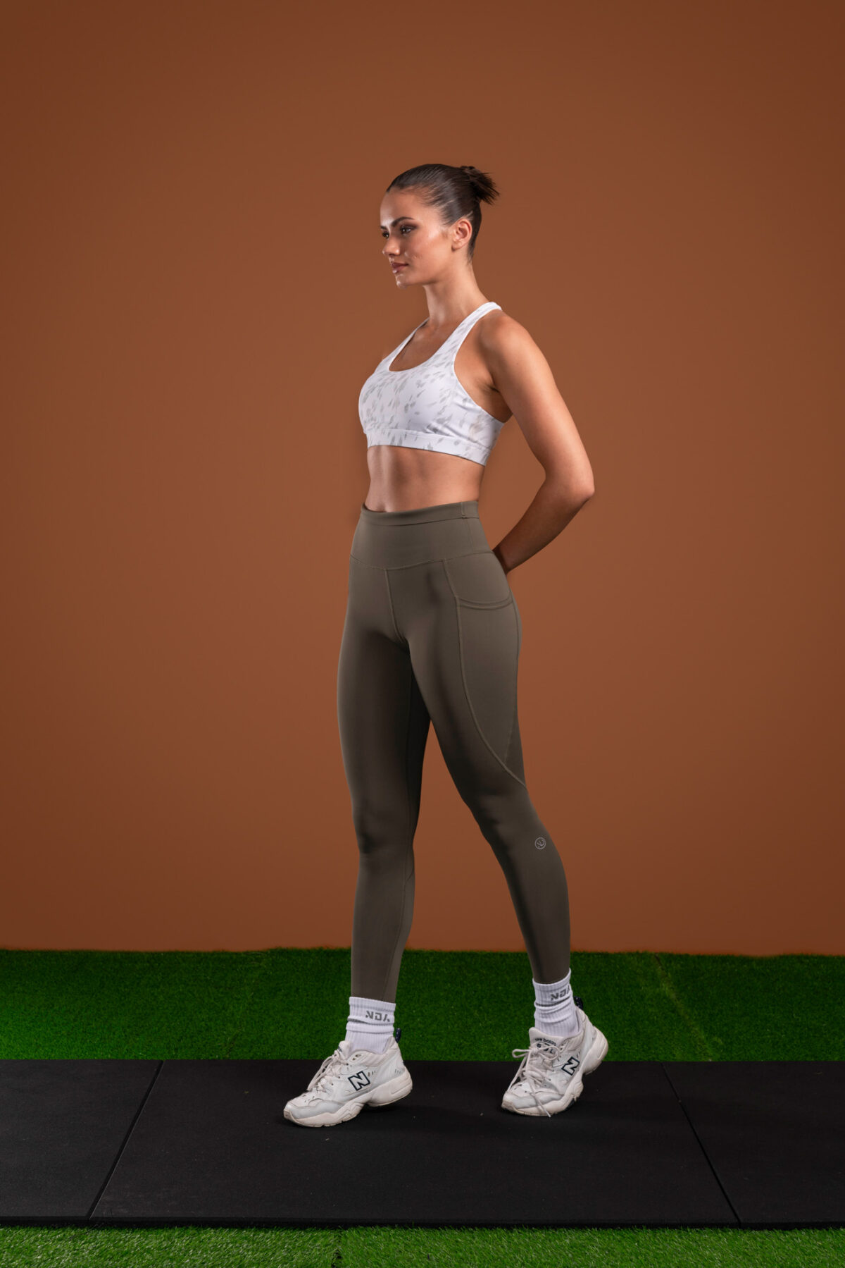 Introducing the Pacesetter Legging (Olive), the perfect choice for running and high tempo training. Our leggings are designed with high intensity in mind, featuring our new Hex-Elastic Technology waistband that provides superior support like no other. The fabric is also squat proof, allowing you to move with confidence. The Legging is designed to keep up with your active lifestyle. The fabric is lightweight and breathable, allowing you to stay cool and comfortable during your workout