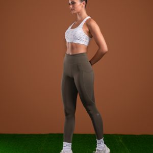Introducing the Pacesetter Legging (Olive), the perfect choice for running and high tempo training. Our leggings are designed with high intensity in mind, featuring our new Hex-Elastic Technology waistband that provides superior support like no other. The fabric is also squat proof, allowing you to move with confidence. The Legging is designed to keep up with your active lifestyle. The fabric is lightweight and breathable, allowing you to stay cool and comfortable during your workout