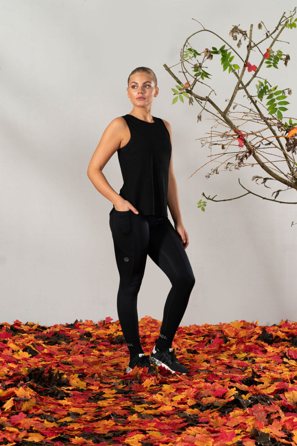 Elevate Vest Top (Black). Made from moisture-wicking fabric, this lightweight and breathable top offers maximum movement and flexibility.