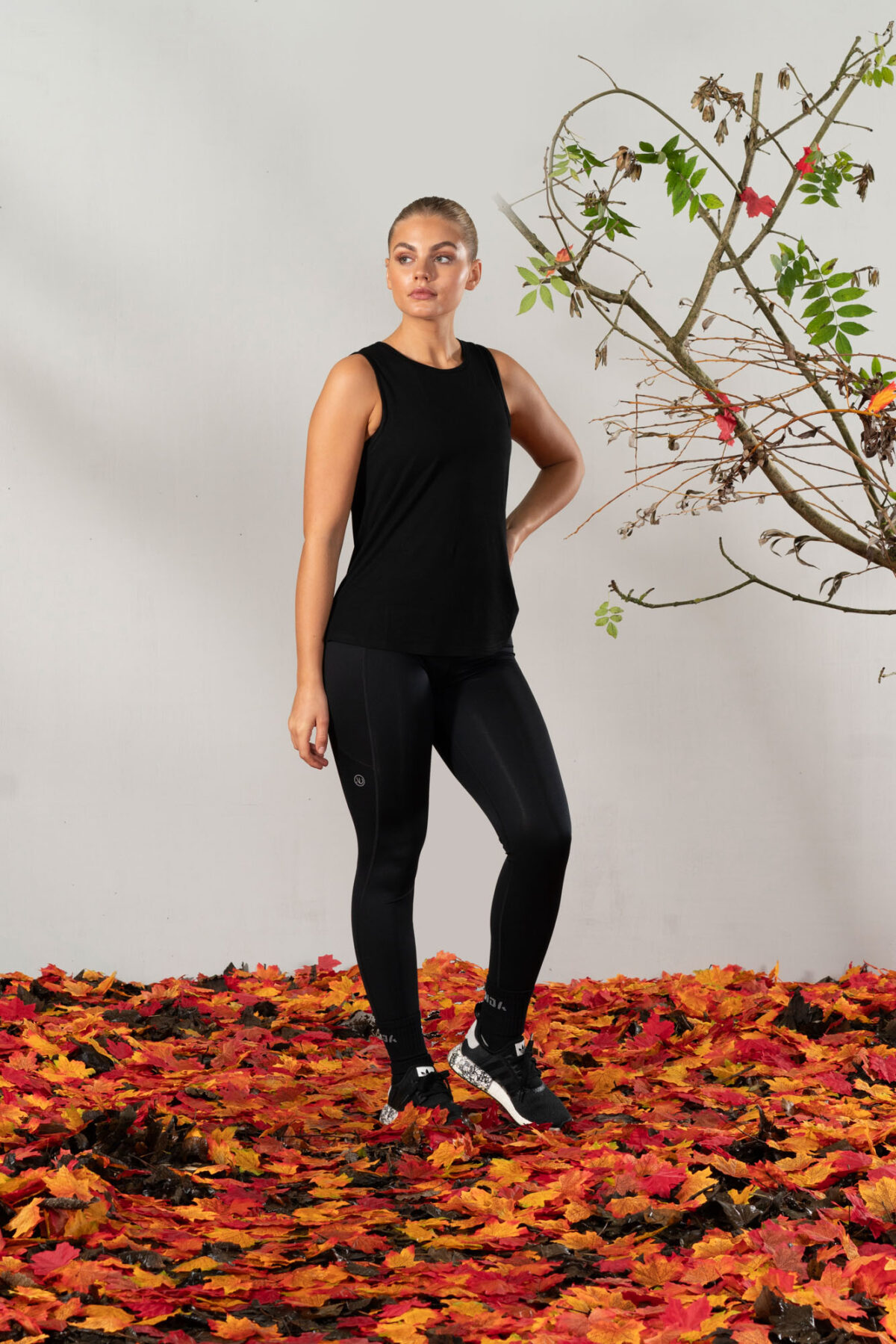 Elevate Vest Top (Black). Made from moisture-wicking fabric, this lightweight and breathable top offers maximum movement and flexibility.