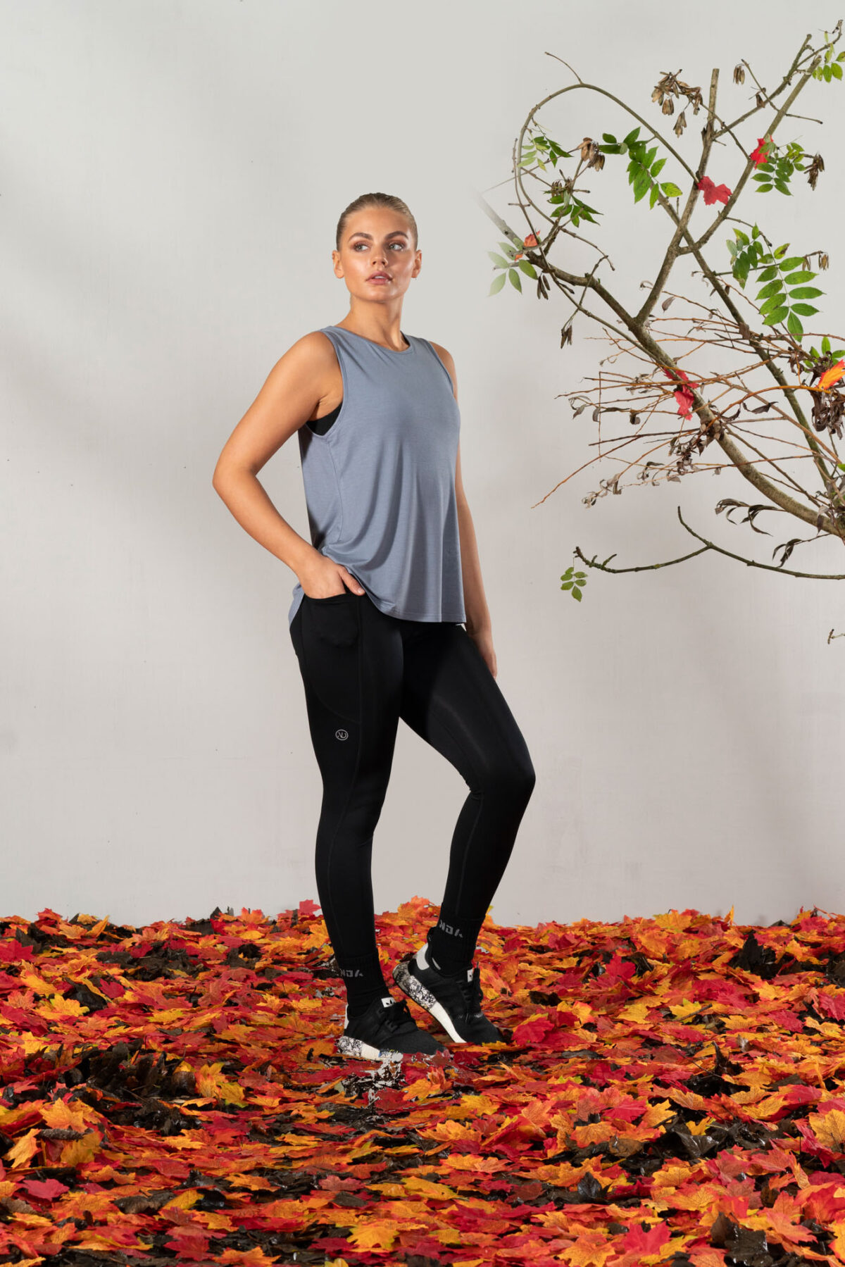 Elevate Vest Top (Steel). Made from moisture-wicking fabric, this lightweight and breathable top offers maximum movement and flexibility.