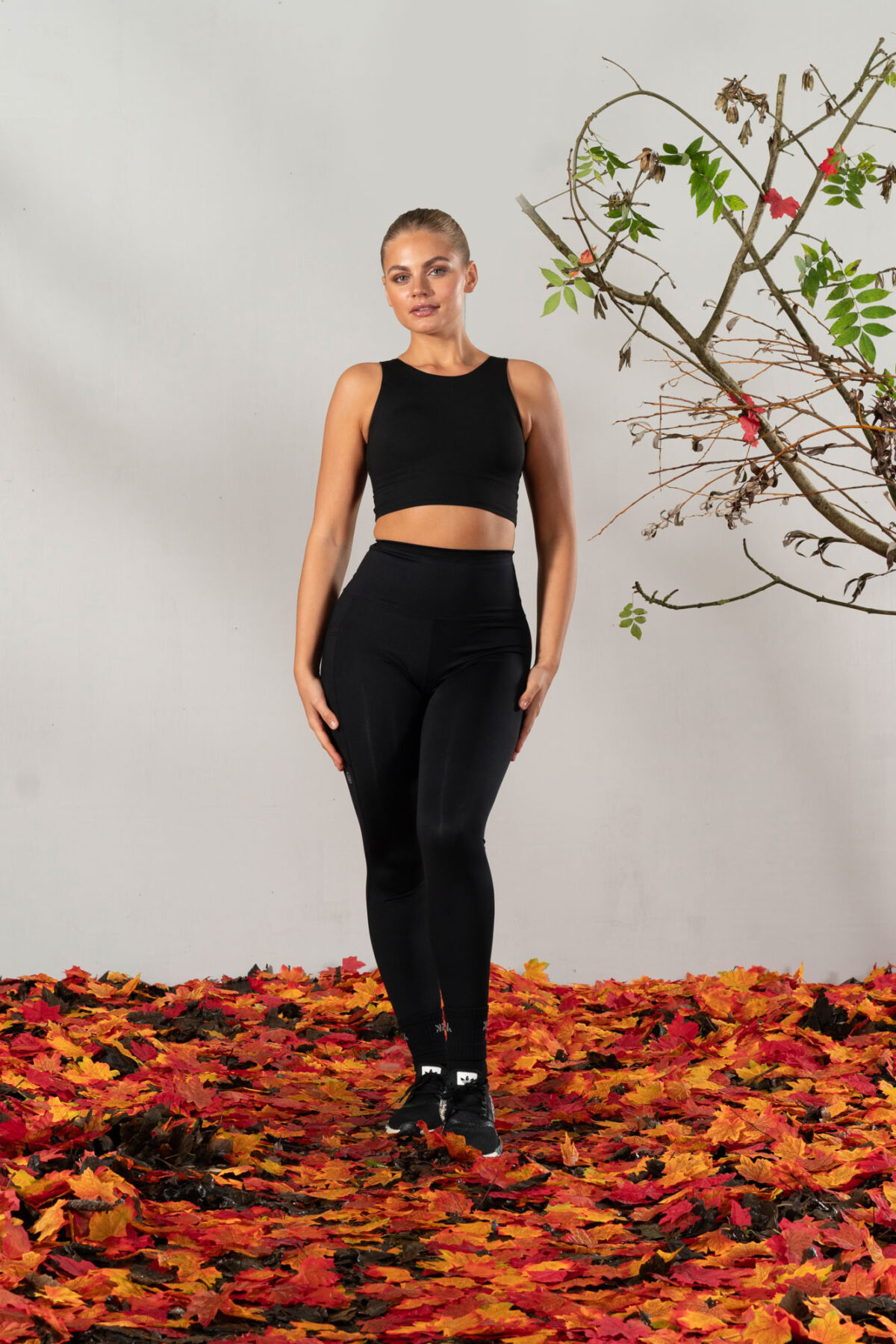 Elevate 2in1 Top (Black). Featuring a built-in under bra and seamless design, this top offers unbeatable support and a flattering silhouette.