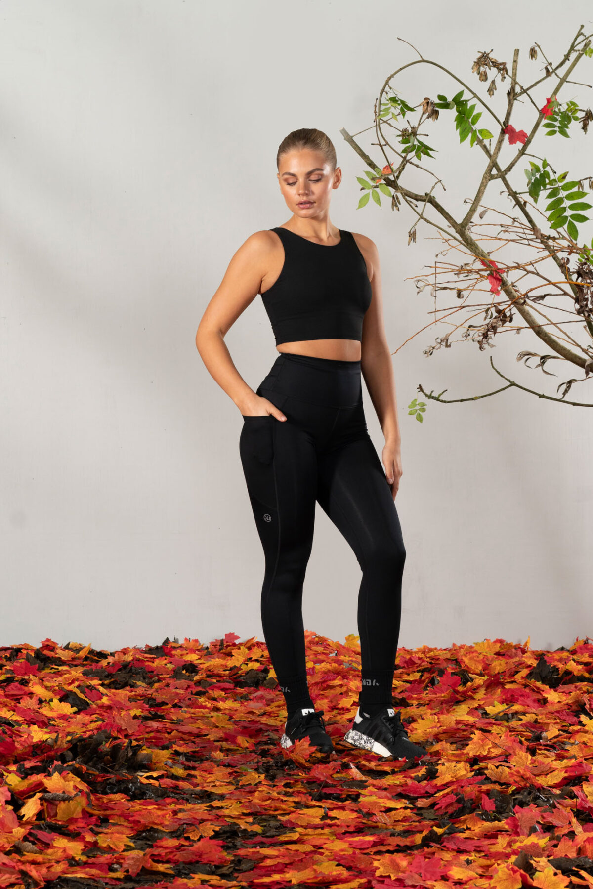 Elevate 2in1 Top (Black). Featuring a built-in under bra and seamless design, this top offers unbeatable support and a flattering silhouette.