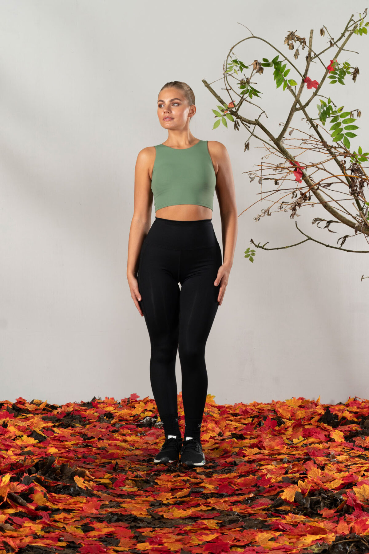 Elevate 2in1 Top (Olive). Featuring a built-in under bra and seamless design, this top offers unbeatable support and a flattering silhouette.