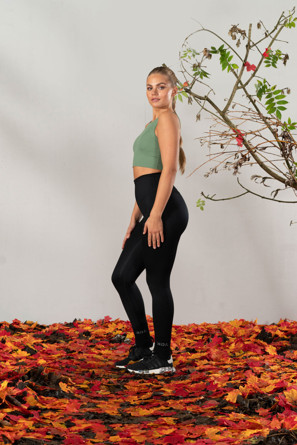 Elevate 2in1 Top (Olive). Featuring a built-in under bra and seamless design, this top offers unbeatable support and a flattering silhouette.