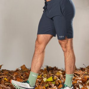 Elevate Men's Shorts (Navy), the perfect combination of style and functionality. Crafted with lightweight material, these shorts provide ultimate comfort and breathability for all your activities. Featuring two side pockets and an additional zip pocket, you can easily store your essentials while on the move.