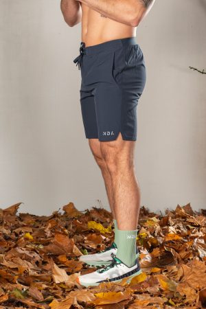 Elevate Men's Shorts (Navy), the perfect combination of style and functionality. Crafted with lightweight material, these shorts provide ultimate comfort and breathability for all your activities. Featuring two side pockets and an additional zip pocket, you can easily store your essentials while on the move.