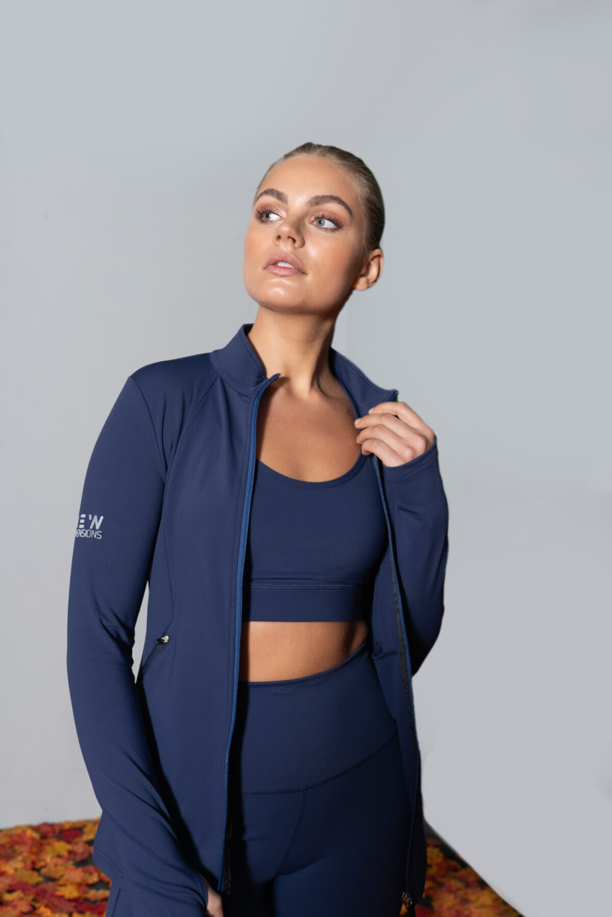 Elevate Zip Jacket (Navy). Crafted from premium compression material, this full zip jacket offers a snug fit with full range of motion.