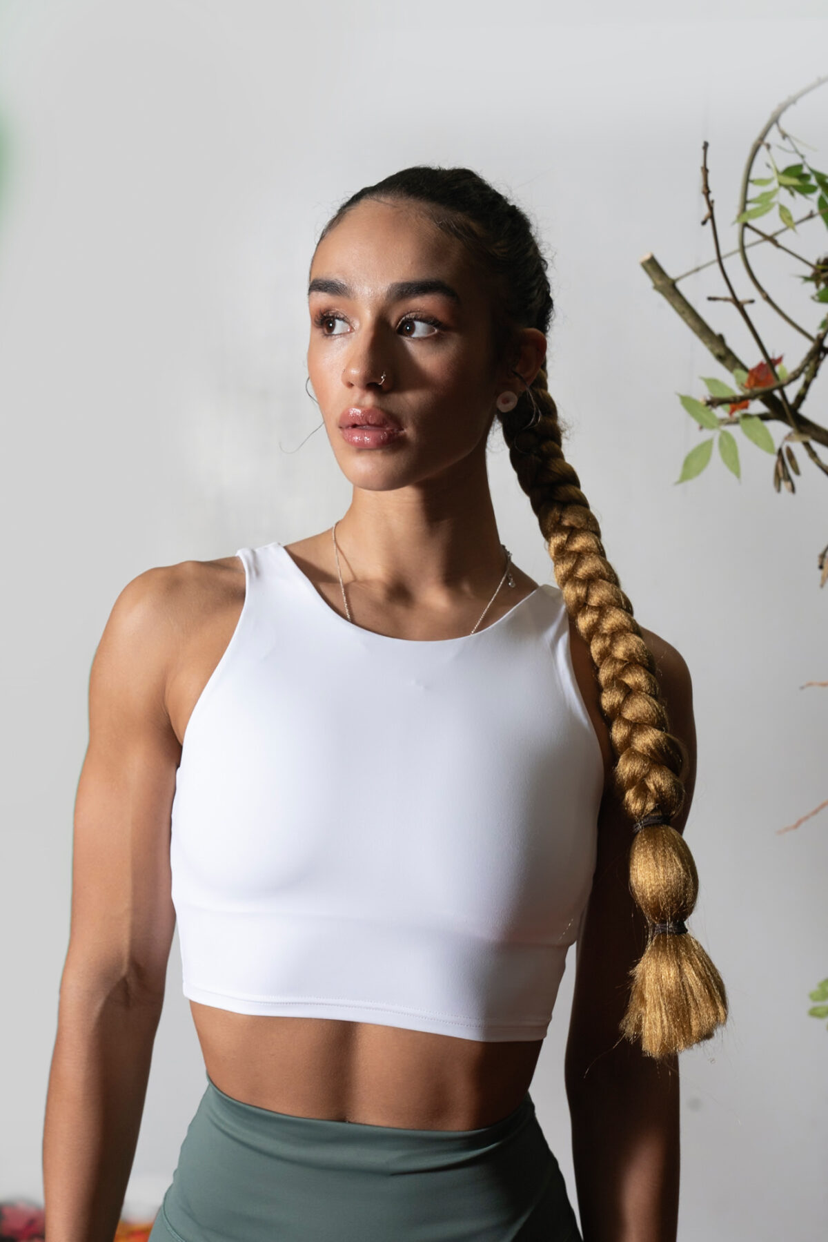 Elevate 2in1 Top (Olive). Featuring a built-in under bra and seamless design, this top offers unbeatable support and a flattering silhouette.