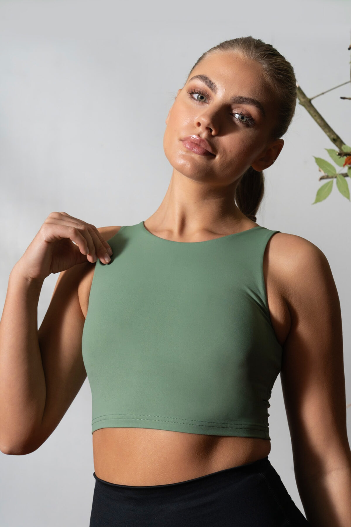 Elevate 2in1 Top (Olive). Featuring a built-in under bra and seamless design, this top offers unbeatable support and a flattering silhouette.