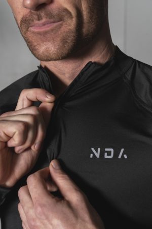 Elevate ¼ Zip (Black), the ultimate performance top. Made with a perfect blend of polyester and spandex, this top offers unparalleled comfort and flexibility. Whether you're warming up or cooling down, the Elevate 1/4 Zip has you covered.