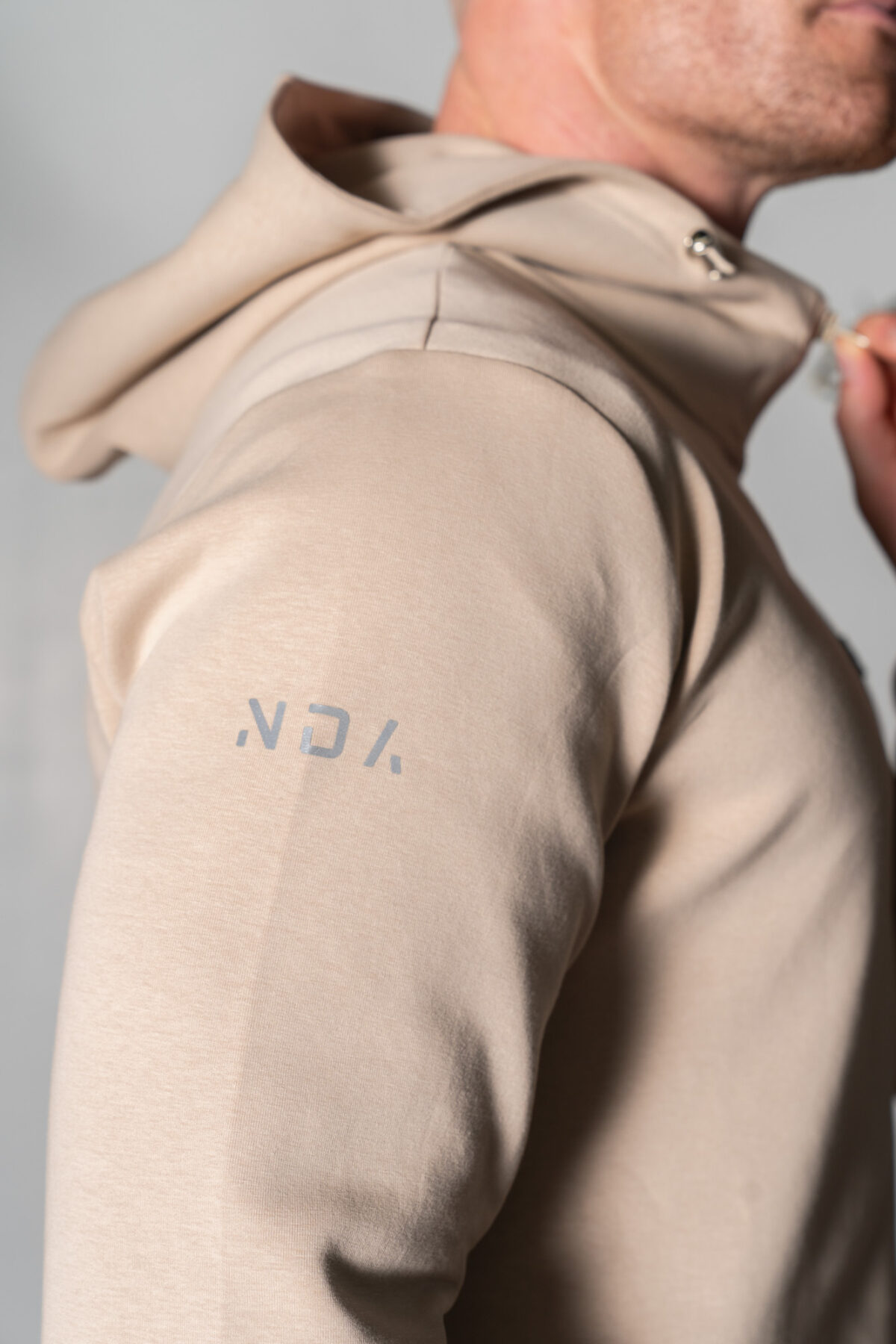 Deluxe Men’s Hoodie (Beige), crafted with our exclusive deluxe material for a truly luxurious and functional experience. This ultra modern hoodie is designed to elevate your style and provide ultimate comfort. Our deluxe material has a unique scuba-like texture that will make you stand out from the crowd.