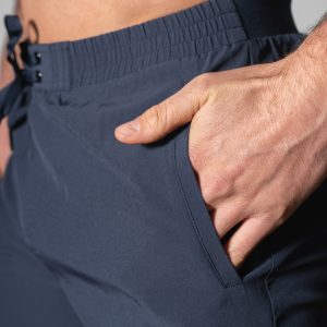 Elevate Men's Shorts (Black), the perfect combination of style and functionality. Crafted with lightweight material, these shorts provide ultimate comfort and breathability for all your activities. Featuring two side pockets and an additional zip pocket, you can easily store your essentials while on the move.