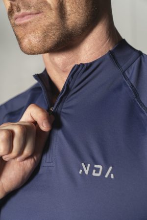 Elevate ¼ Zip (Navy), the ultimate performance top. Made with a perfect blend of polyester and spandex, this top offers unparalleled comfort and flexibility. Whether you're warming up or cooling down, the Elevate 1/4 Zip has you covered.