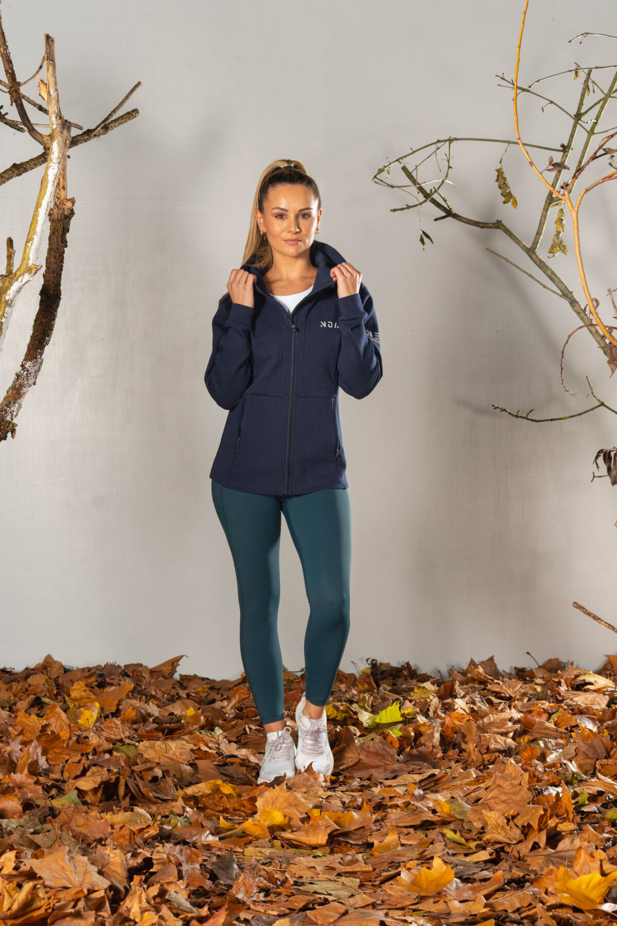 Deluxe Refined Hoodie (Navy), the ultimate combination of style and functionality. This shape-enhancing full zip hoodie is the perfect layering piece for any occasion.