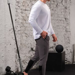The Benchmark Long Sleeve (White) is perfect for any activity. Whether you’re running, working out, or just lounging around, this shirt will keep you comfortable and looking great. The cotton blend material is lightweight and breathable, so you won’t have to worry about overheating. Additionally, the 8 way stretch material allows you to move freely without feeling restricted.