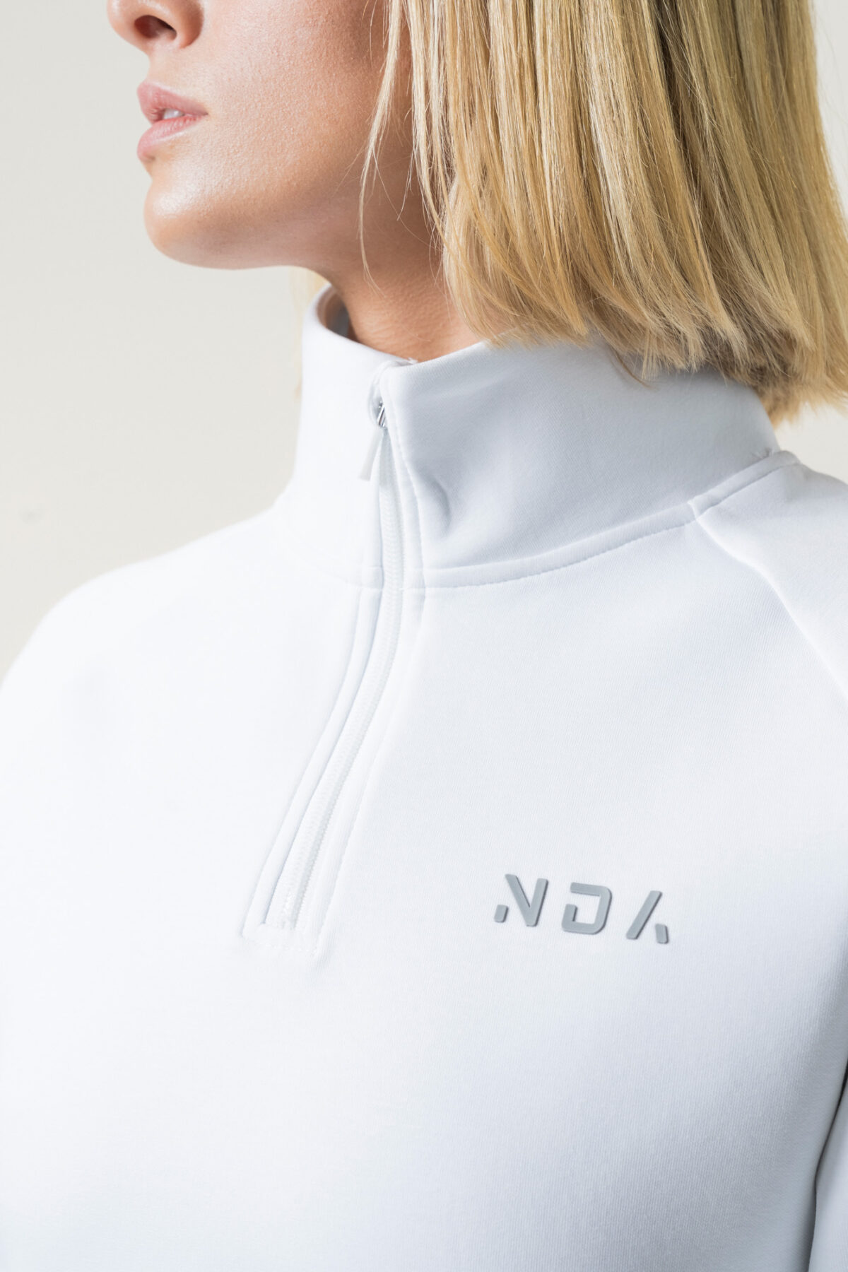 Premium & Practical - the Deluxe ¼ Zip (White). Made from our deluxe material, this 1/4 zip is designed to keep you warm and cosy during the colder months. The fabric is soft & heavy to the touch and provides ultimate comfort, making it a must-have for your wardrobe.