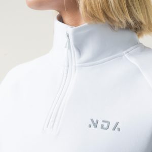Premium & Practical - the Deluxe ¼ Zip (White). Made from our deluxe material, this 1/4 zip is designed to keep you warm and cosy during the colder months. The fabric is soft & heavy to the touch and provides ultimate comfort, making it a must-have for your wardrobe.