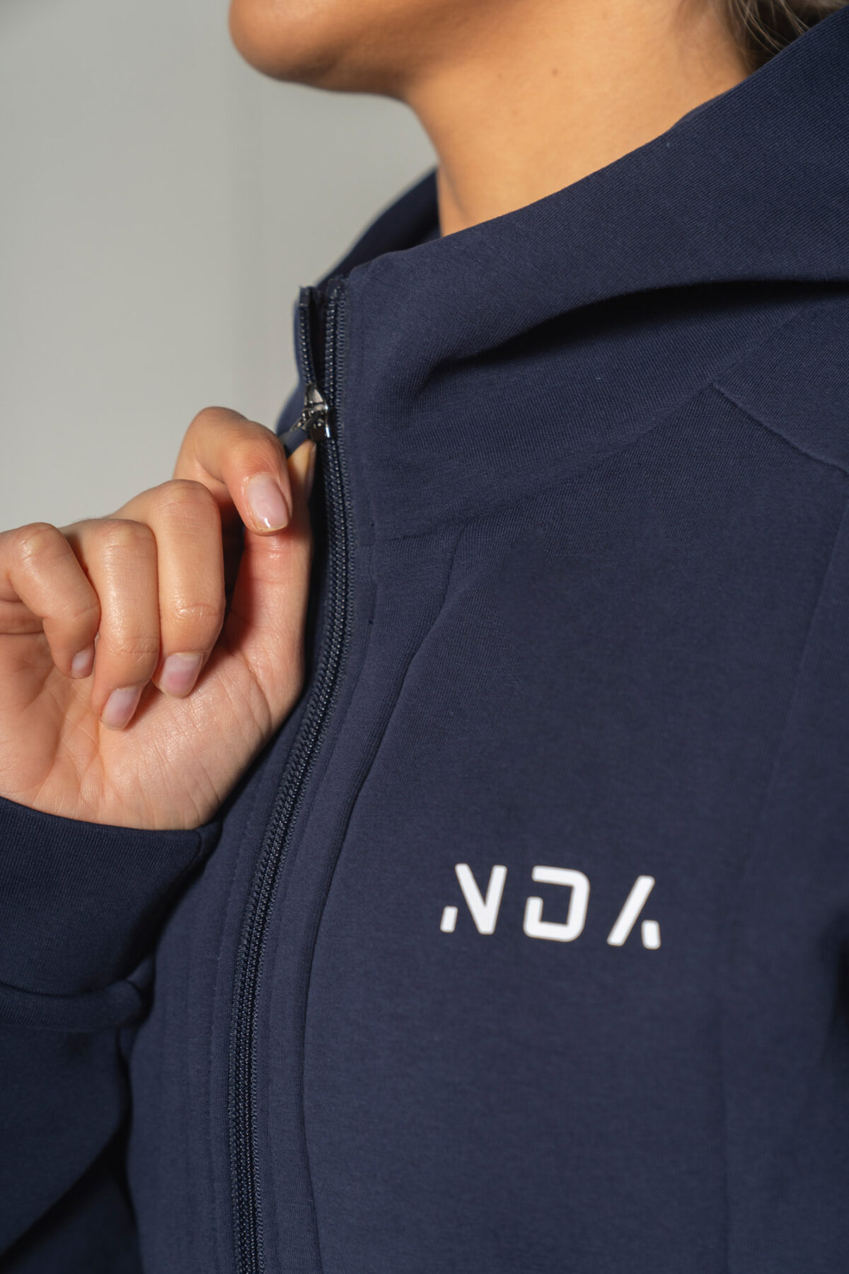 Deluxe Refined Hoodie (Navy), the ultimate combination of style and functionality. This shape-enhancing full zip hoodie is the perfect layering piece for any occasion.